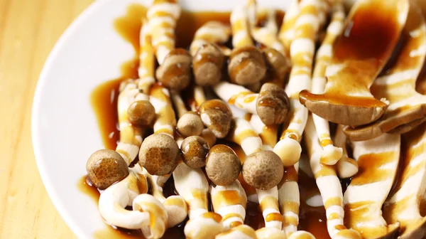 Brown Mushroom on dish with sauce. — Stock Photo, Image