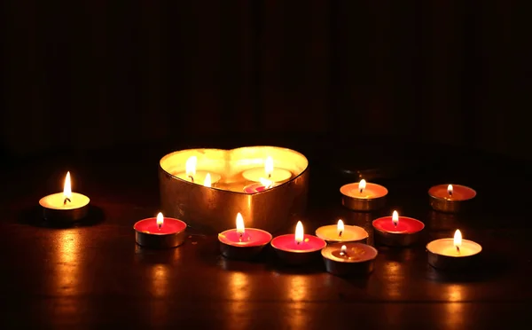 Burning candle heart shape — Stock Photo, Image