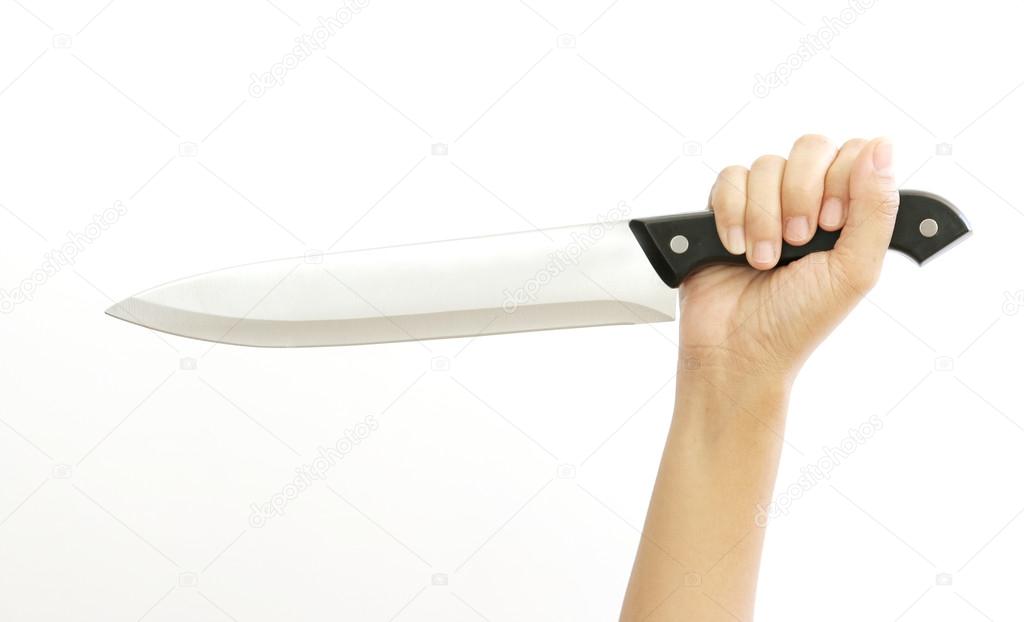 Woman hand is holding a kitchen knife