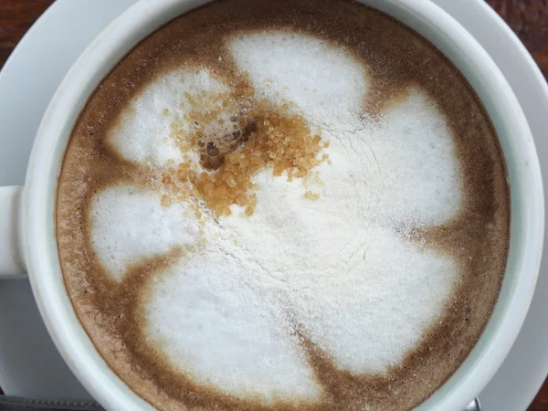 Hot latte coffee in white cup. View from above. — Stock Photo, Image