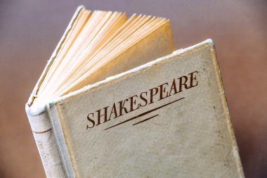 An old book by Shakespeare clipart
