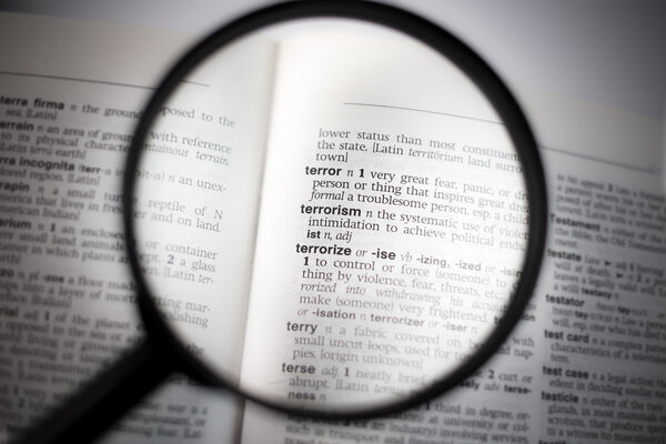 Word "terrorism" seen through magnifying glass