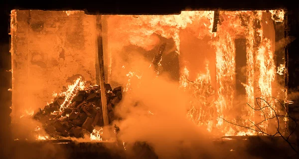 Part of a House on Fire. Window view to Fire Inside Wooden Old H