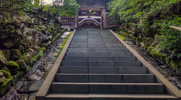 Path and steep stone steps, and trees, in summer. Eiheiji, Japan.