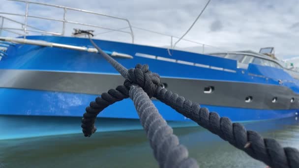 Tight Mooring Line Holds Blue Yacht Pier — Stock video