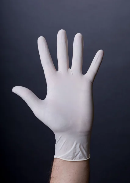 Male palm in latex glove — Stock Photo, Image