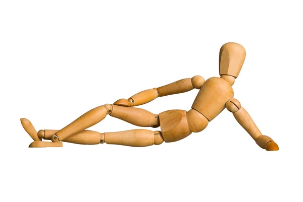 Wooden mannequin lying down — Stock Photo, Image