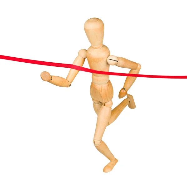 Wooden mannequin running through finishing line — Stock Photo, Image