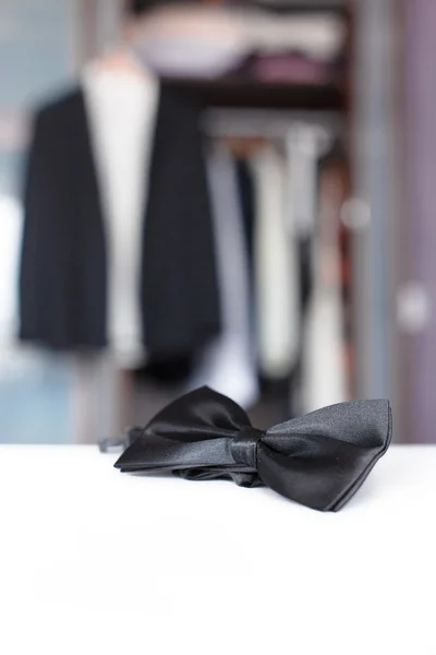 Bow tie. Open closet and tuxedo. — Stock Photo, Image