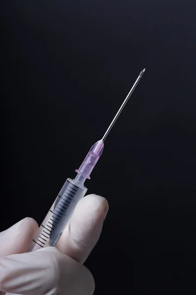 Hand with syringe — Stock Photo, Image