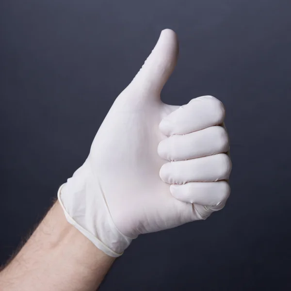 Manlig hand i latex handske — Stockfoto