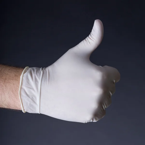 Male hand in latex glove — Stock Photo, Image