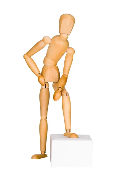 Wooden mannequin lean on the box. — Stock Photo, Image