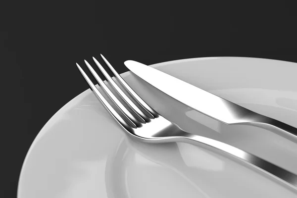 Fourchette et couteau avec assiettes — Photo