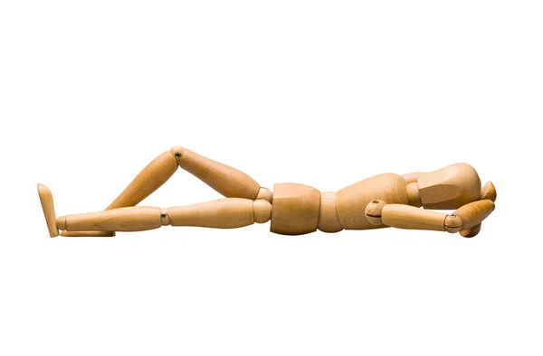 Wooden mannequin lying down — Stock Photo, Image