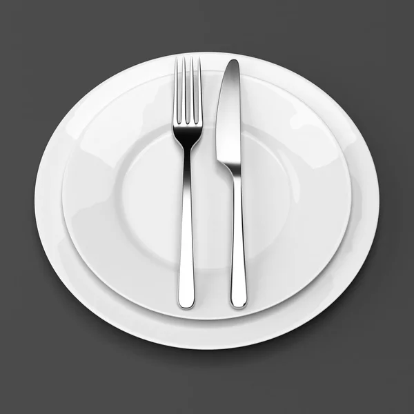 Fork and knife with plates — Stock Photo, Image