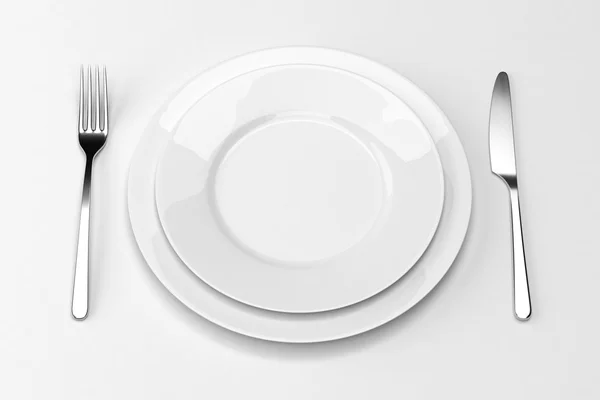 Fork and knife with plates — Stock Photo, Image