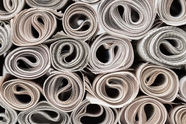 Rolls of newspapers.