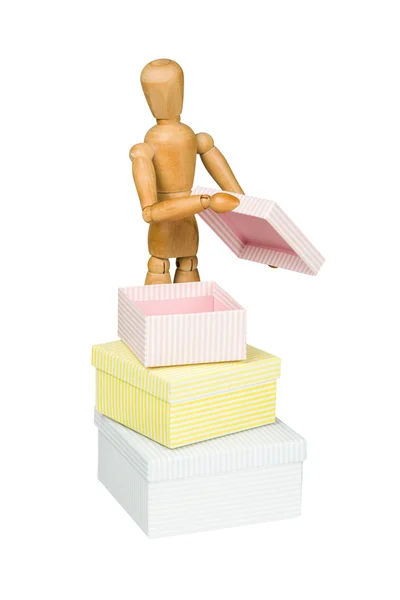 Wooden mannequin opens little box — Stock Photo, Image