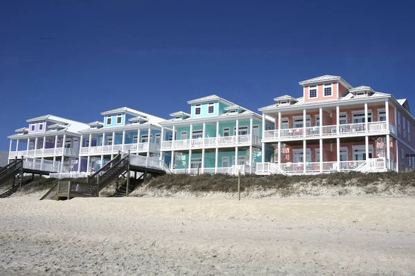 Row of multicolored beach houses 