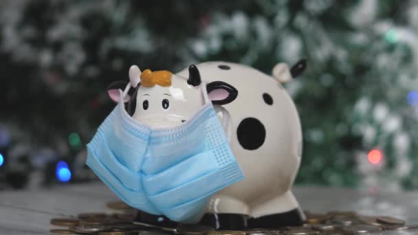 Piggy bank white bull in a mask. Christmas. 2021 new year. Year of the bull. Concept. Saving money as a way of life. Close-up — Stock Video