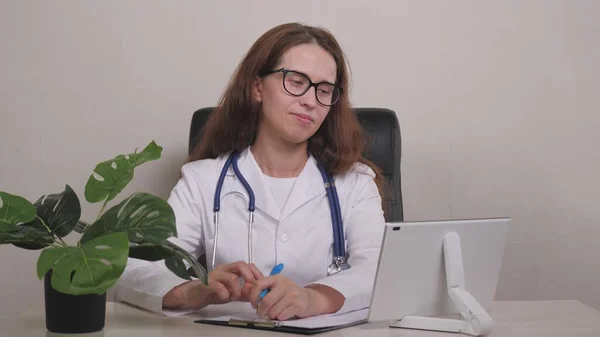 Point of View: Man Using Smartphone to Talk to His Doctor via Video Conference Medical App. Person Checks Symptoms, Talks with Physician, Using Online Video Chat Application.