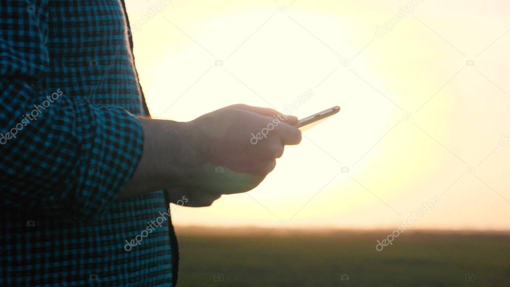 Agribusiness technology in the field ipad agricultural control precision agriculture Farmer ipad in cultivated soybean field, applying modern technology in agricultural activity, selective focus