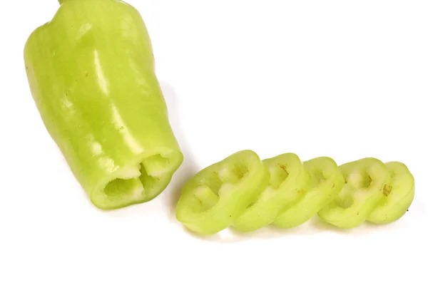 Pimentos doces verdes e sementes em um fundo branco — Fotografia de Stock