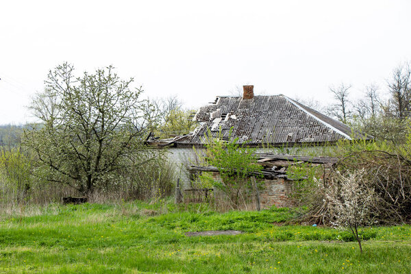 Burnt house half-burnt roof of a house with half a roof in the Kirovograd region