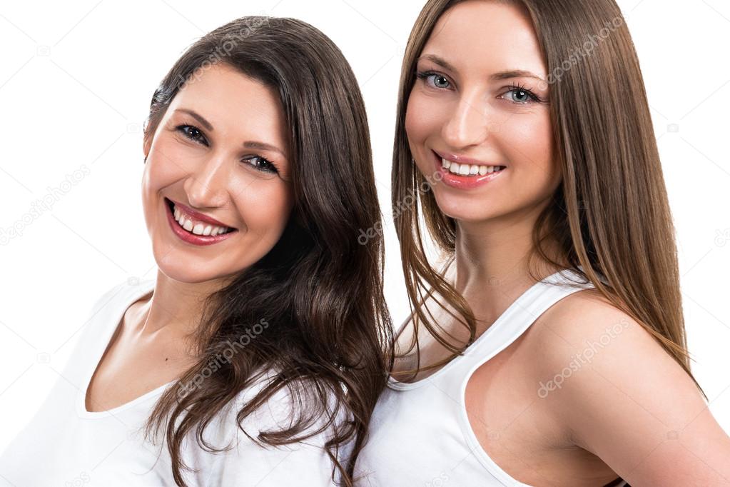 Portrait of two beautiful women on a white background