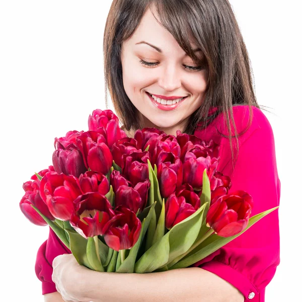 Portret van mooie vrolijke vrouw met tulpen — Stockfoto