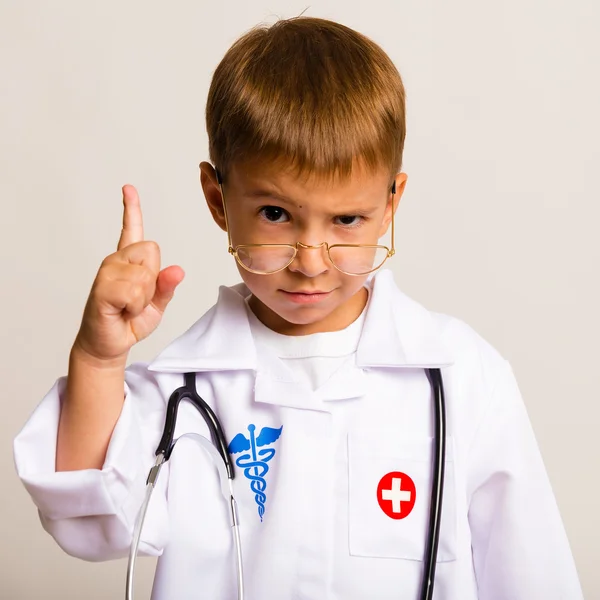 Portrait of a child with glasses and a suit doctor — Stock Photo, Image