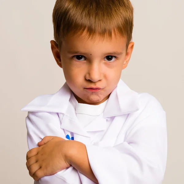 Portrait of serious child in the doctor's suit — Stock Photo, Image