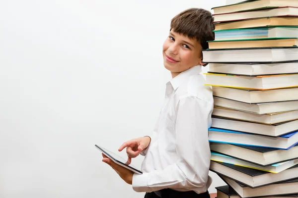 Teenage boy reading an e-book. — Stock Photo, Image