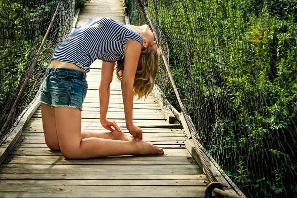 Sports girl on the bridge — Stock Photo, Image
