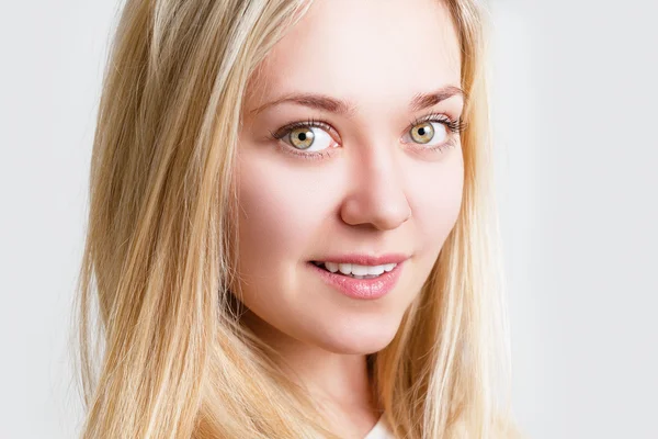 Portrait of a beautiful cheerful a young woman. Female face closeup — Stock Photo, Image