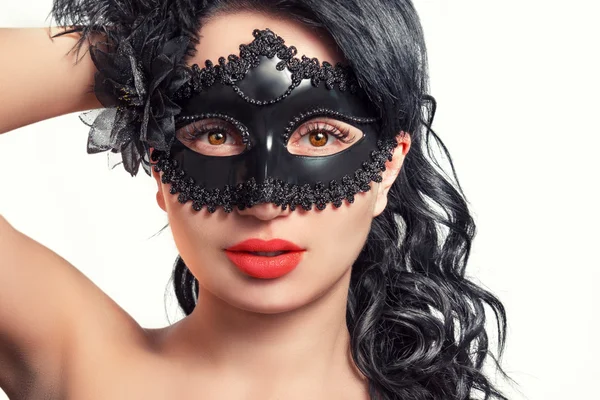Portrait of a beautiful young woman in a black mask — Stock Photo, Image
