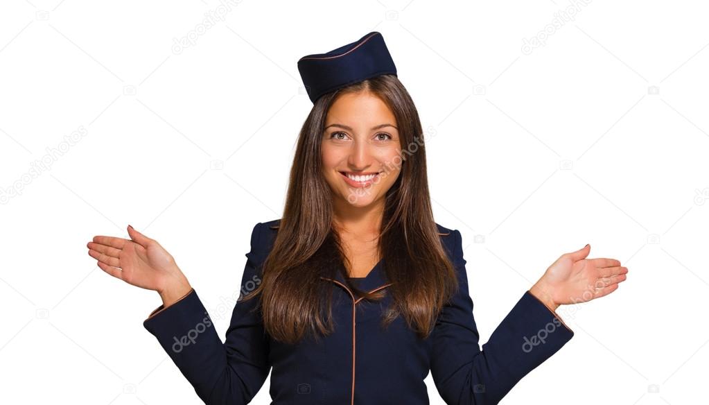 Portrait of a beautiful young woman dressed as a stewardess on a white background