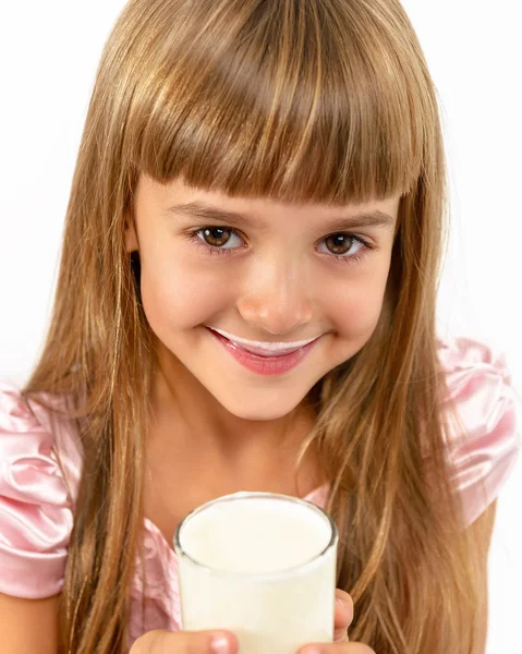Portrait of a little happy girl with a glass of yogurt. — Stock Photo, Image