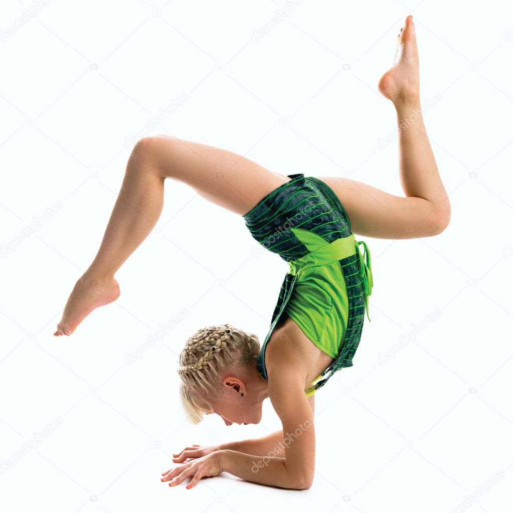 Young gymnast on a white background.