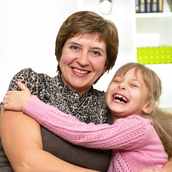 Portrait of happy grandmother and granddaughter. — Stock Photo, Image