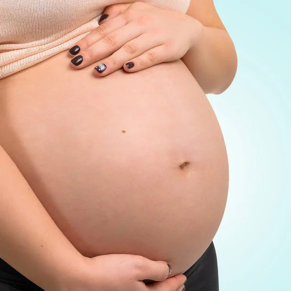 Pregnant woman. On the photo belly closeup. — Stock Photo, Image