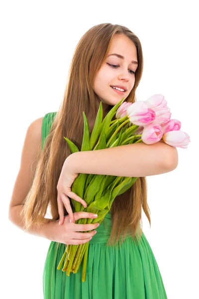 Retrato de una hermosa joven con flores sobre un fondo blanco — Foto de Stock
