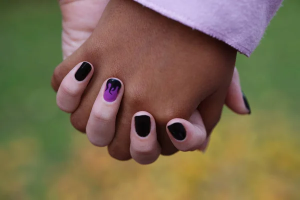 black and white hand together