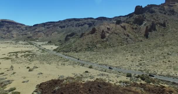 Aerial flight above road through lunar landscape in Teide National Park, Tenerife, Canary Islands, Spain — Stock Video