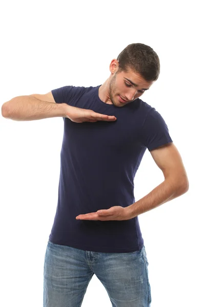 Чоловік у футболці, вказуючи йому руки. ізольовані — стокове фото