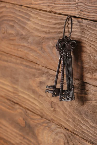 vintage keys on wooden planks background