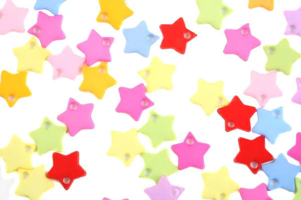 Estrelas coloridas confete no fundo branco — Fotografia de Stock