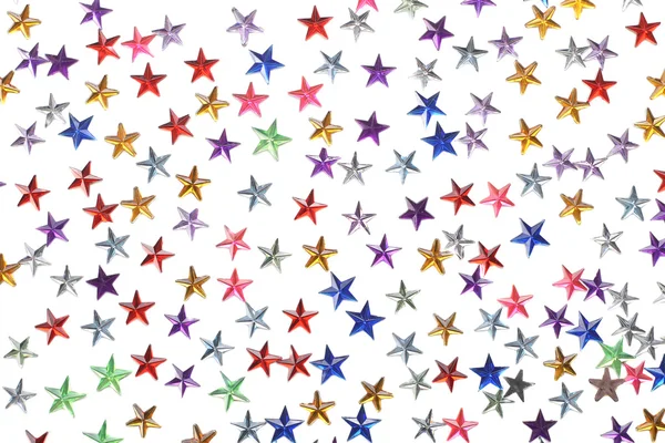 Farbige Sterne Konfetti auf weißem Hintergrund — Stockfoto