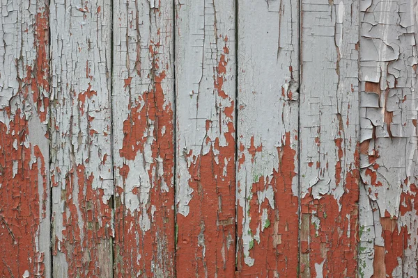 Pintura agrietada en tablas viejas. antecedentes . —  Fotos de Stock